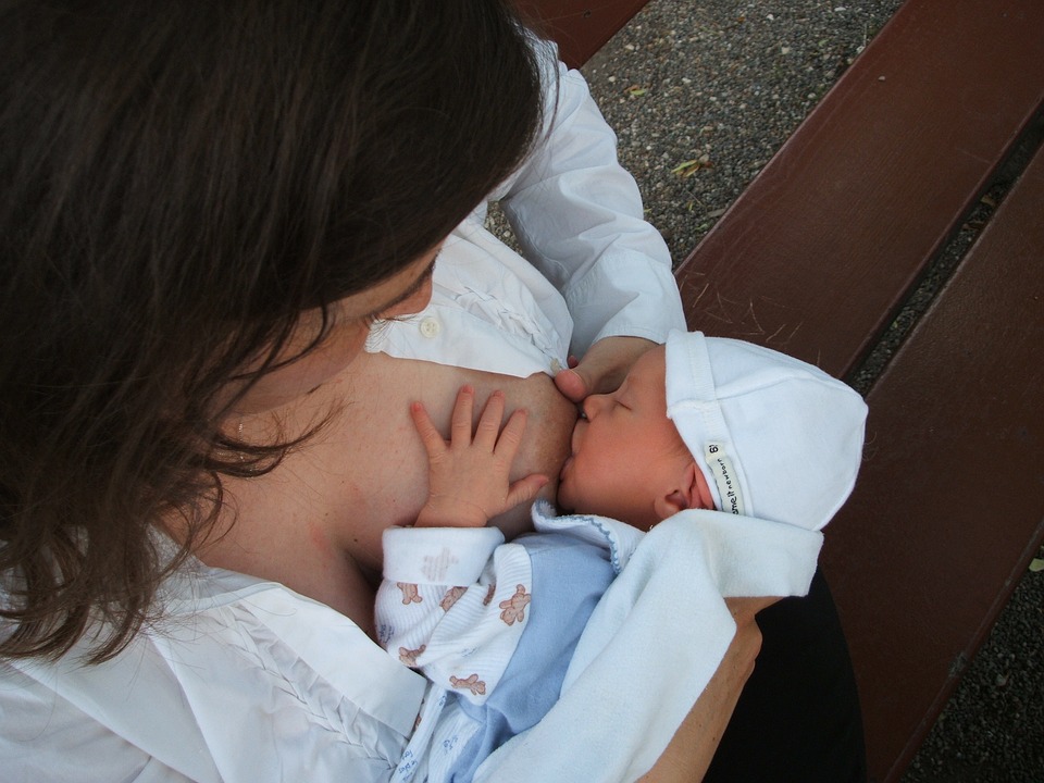 A mother breastfeeding her baby